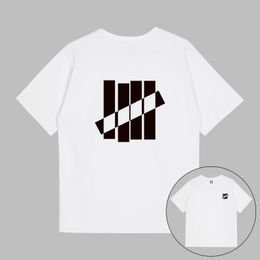 Camisetas de diseñador para hombre INVICTO Negro Blanco ICON S / S Tee UNDFTD Japón Impreso Moda hombres camiseta 100% algodón Casual manga corta Streetwear Camisetas de gran tamaño S-2XL