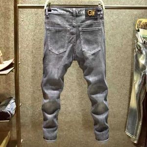 Heren vier seizoenen slanke pp gewassen zwart hete boor strakke stretch casual mode go-go trend in het taille gat kleine been jeans l2403