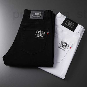 Heren jeans ontwerper 2023 lente/zomer nieuwe high-end Koreaanse editie elastische slanke pasvorm kleine voeten zwart-wit drie verdediging casual broek C4UM
