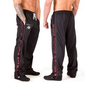 Jogger pour hommes pantalons de survêtement Nouveaux pantalons lâches Joggers Pantalons rayés gymnases Vêtements Men's Fitness Workout Sporting Tablers 201110