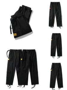 Pantalones para hombre Cargo Streetwear Hip Hop Pantalones casuales estampados Militar Retro Multibolsillos Rectos Monos sueltos Botón Fly pantalones de entrenamiento de pierna recta