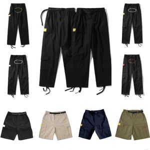 Heren broek vrachtheren streetwear hiphop geprinte casual broek militaire retro multi-pockets rechte losse overalls button vlieg paar rechte been workout broek