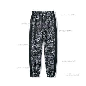 Pantalons pour hommes Designer japonais tête de requin pantalons de survêtement en vrac couleur graffiti qualité jogging ing faisceau pieds mâle femme couple personnalité 2811