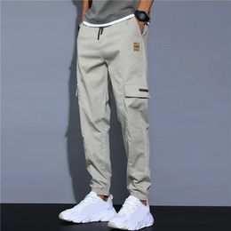 Pantalons pour hommes Poches latérales pour hommes Cargo Harem Rubans Noir Hip Hop Casual Pantalon de jogging pour hommes Mode Streetwear 231218