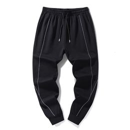 Pantalon homme grande taille 8XL vers le bas pantalon en coton noir en pantalon de survêtement décontracté élastique avec passepoil réfléchissant 230620