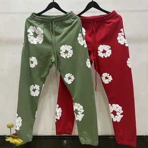 Pantalons pour hommes prêts à l'emploi larmes décontracté hommes femmes Couple Kapok mousse impression haut Hip Hop Streetwear pantalon multicolore J240120