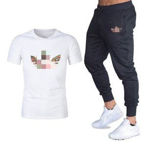 Hommes Motif Impression Survêtement Tendance De La Mode Col Rond À Manches Courtes Tops Slim Pantalon Costumes Designer Mâle Casual Gymnases Fitness Deux Pièces Ensembles