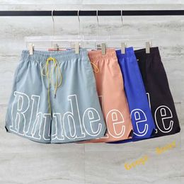 Pantalones cortos para hombre Hombres Mujeres Malla Casual Clásico Impresión grande RHUDE Shorts Streetwear Rosa Verde Azul Cordón Rhude Calzones con etiquetas EZE9