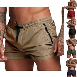 Shorts pour hommes Short extérieur de poche à crampons de dessin élastique couleurs de taille solide confortable en coton respirant Y240417