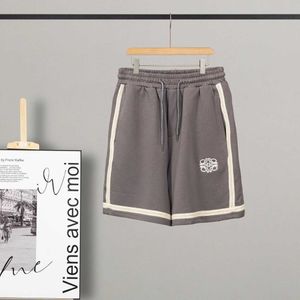 Pantalones cortos para hombres Luo Jia Stitching Micro etiqueta pantalones cortos bordados para hombres y mujeres de moda