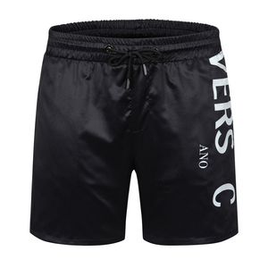 Pantalones cortos de diseñador de verano para hombre Trajes de baño sueltos de moda Ropa de calle para mujer Traje de baño de secado rápido Letras Tablero impreso Pantalones de playa Hombres S Swim Short M-3XL # 98