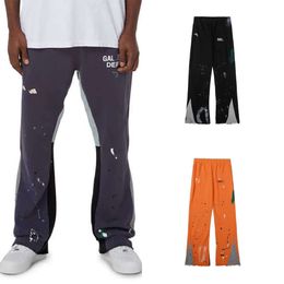 Pantalones de chándal para hombre Diseñador Pantalones deportivos de algodón Jeans Jeans pintados a mano Palacado de tinta cosida y femenina High Street Draward