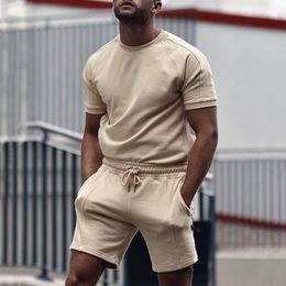 Survêtements pour hommes hommes pièces tenues été décontracté col rond muscle manches courtes t-shirts et coupe classique short de sport ensemble survêtement