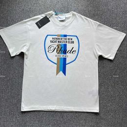 Camisetas para hombre Diseñador Ropa de moda Camisetas Camisetas Rhude Bandera de verano Impreso Camiseta de manga corta Camiseta Calle Pareja Letra Algodón puro Ropa de calle Suelta Hip hop Luxu