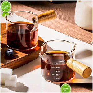 Jarras de leche Nuevo Nxi Mango de madera Taza medidora de espresso de vidrio Jarra de leche de boca doble / simple Jarra de leche de café Plato de salsa de cocina Línea graduada Gota Dhkdk