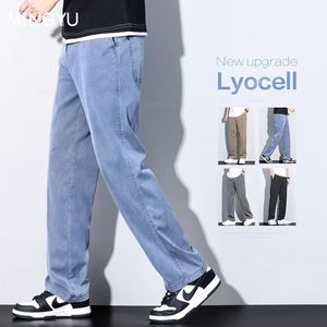 Mingyu marque vêtements doux Lyocell tissu jean hommes bleu taille élastique ample droit Denim pantalon mâle grande taille M5XL 240227