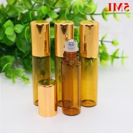 Mini 5 ml de verre ambré brun sur des bouteilles de parfum d'huile essentielle avec bille roulante en acier inoxydable et bouchon en or en gros 1100 Pcs / Lot Pxnja