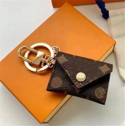 Mini portefeuille porte-clés marque classique designer porte-clés hommes écouteurs sacs porte-clés femmes boucle porte-clés à la main en cuir couple sacs de mode pendentif