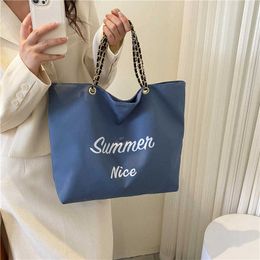 Sac fourre-tout minimaliste pour femmes à la mode japonaise et coréenne toile imprimée lettre sac à bandoulière unique personnalisé Instagram sac pour femmes 240315