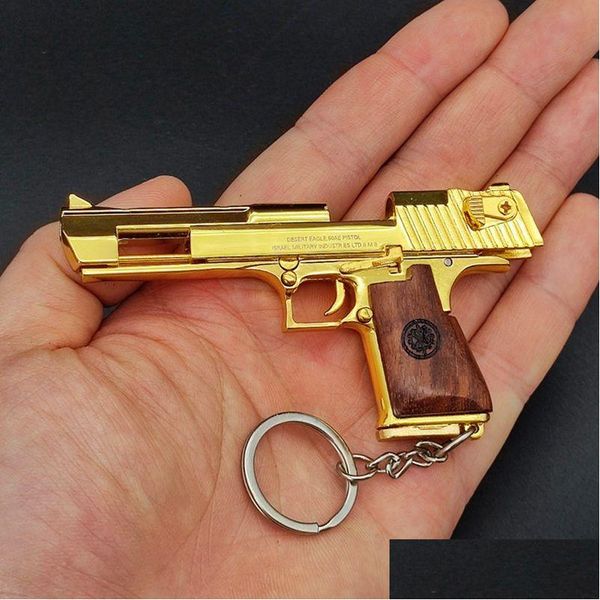 Accesorios de modo Color dorado Desert Eagle Pistola Pistola de juguete Modelo en miniatura Mango de madera Llavero Metal Shell Aleación Regalo de cumpleaños 1159 Dr Dhpae