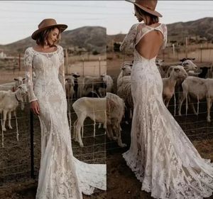 Robes de mariée sirène gothiques modernes à manches longues 2022 Appliques en dentelle Scoop Neck Illusion Dos nu Boho Robes de mariée Robes de Mariee