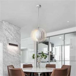 Lustre de restaurant créatif minimaliste moderne personnalité nordique lampes suspendues de cuisine lampes de lune de créateur d'art moderne