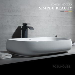 Évier de salle de bain européen simple moderne bassin ovale carré de lavabo en céramique Personnalité créative Basin d'art blanc pur