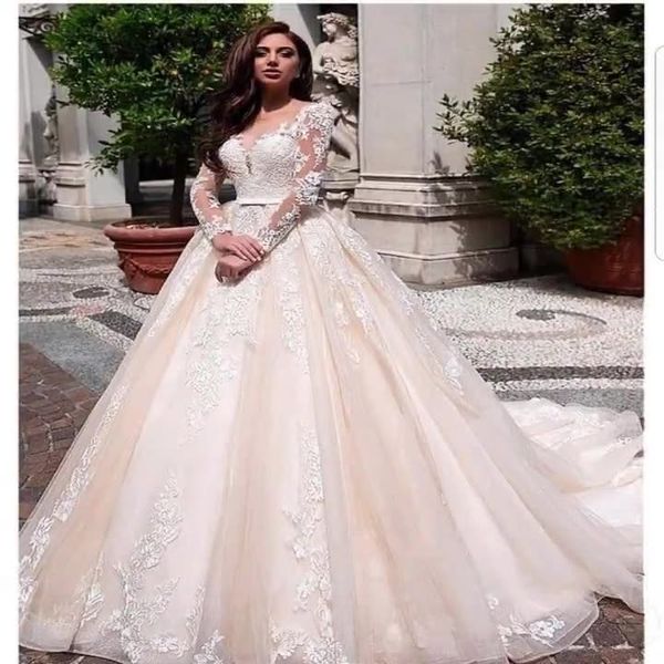 Vestidos de novia modestos de manga larga una línea Vestidos de novia de encaje Cuello de joya transparente Lentejuelas con apliques de encaje Tallas grandes Robe De Mariee Vestidos hasta el suelo plisados ​​por encargo