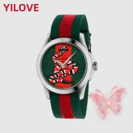 Montre De Luxe Movimiento de cuarzo Marca famosa Reloj Mujer Hombre Abeja Serpiente Tigre Patrón Nylon Cinturón Reloj Impermeable Clásico Redondo ﾠ Dial Caja de acero inoxidable Relojes de pulsera