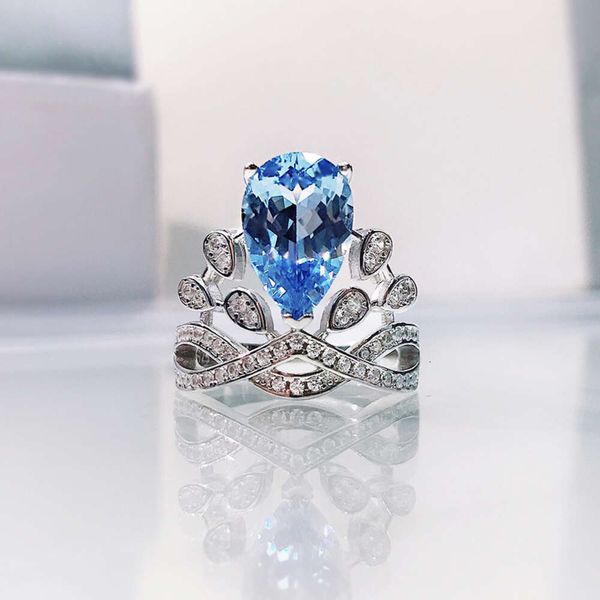 Mu Jing Jewelry 2023 Nuevo anillo de corona 8 * 12 Anillo de circón del tesoro azul marino Estilo de moda simple y elegante para mujer