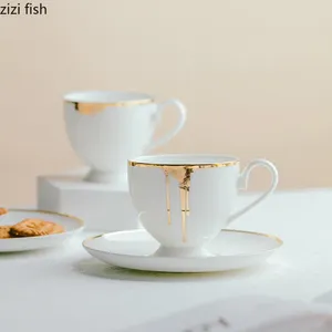 Tasses en céramique tasse de tasse de tasse de porcelaine et soucoupe Set Golden Flow Glazes After Afternoon Tea Accessoires Plat