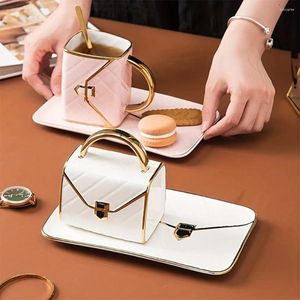 Tasses Représentation de tasses et soucoupes en or et soucoupes Set Creative Bag Forme Céramique Business Gifts Activités