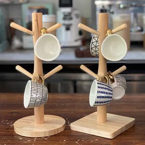 Soporte para taza de café japonés, estante de almacenamiento de madera de escritorio, Mini taza de agua de leche de cerámica de estilo nórdico con mango dorado