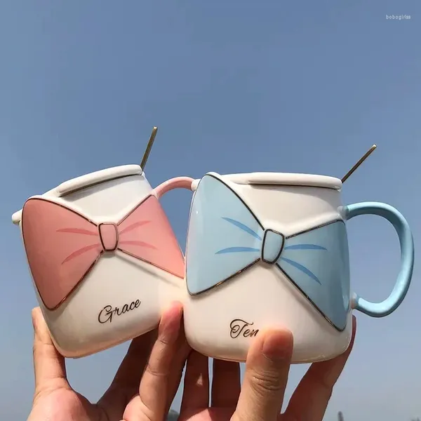 Tazas Versión coreana Lovely Ins Coffee Cup Bow with Cover Spoon Taza Femenina Femenina Desayuno de cerámica para el hogar