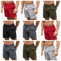 Muscle Fitness Shorts Été Casual Sports Running Hommes Demi-Pantalon Basket-ball Formation Solide Hommes Casual Séchage Rapide Stretch B8041