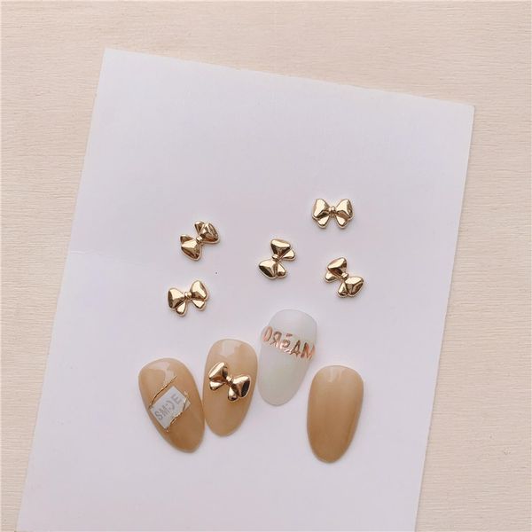 Decoraciones para uñas 100pcs / Lot Mini-Bowknot Metal Nail Ornament Estilo coreano Rose-Gold 3d Diy Manicure Ribbon Golden Bow-Knot Aleación Decoración de uñas 230629