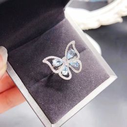 Anillo de Topacio azul cielo Natural mariposa femenina 925 plata pura chapada en oro joyería de lujo ligera fábrica al por mayor