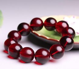 Vin naturel rouge baltique cire d'abeille sang percussion bracelet rouge transfert hommes et femmes modèles bracelet cadeau en gros