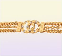 Ne jamais déchaîner des colliers pendentifs de créateur à double lettre à 18 carats à l'or