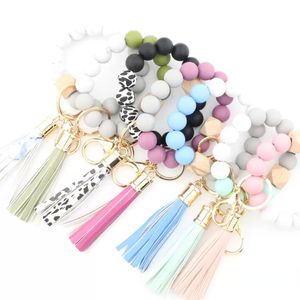 Nouveaux 14 styles de bracelets de perles en silicone à la mode, porte-clés à pampilles en hêtre, pendentif en cuir, bijoux pour femmes, cadeaux de fête, accessoires décoratifs