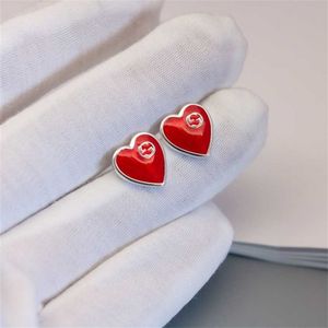 Nieuwe 2023 designer sieraden armband ketting ring in elkaar grijpende emaille rode persoonlijkheid veelzijdige hartvormige damesoorbellen