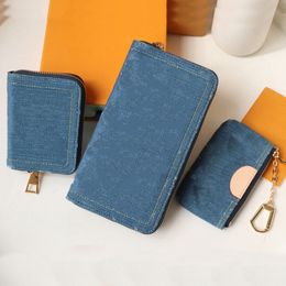 Nuevo 2024 Bolsa de llaves Diseñador de lujo Denim Azul Cuero genuino Hardware dorado Cartera Mujer Moda Forro de algodón Cierre con cremallera Bolso de mano