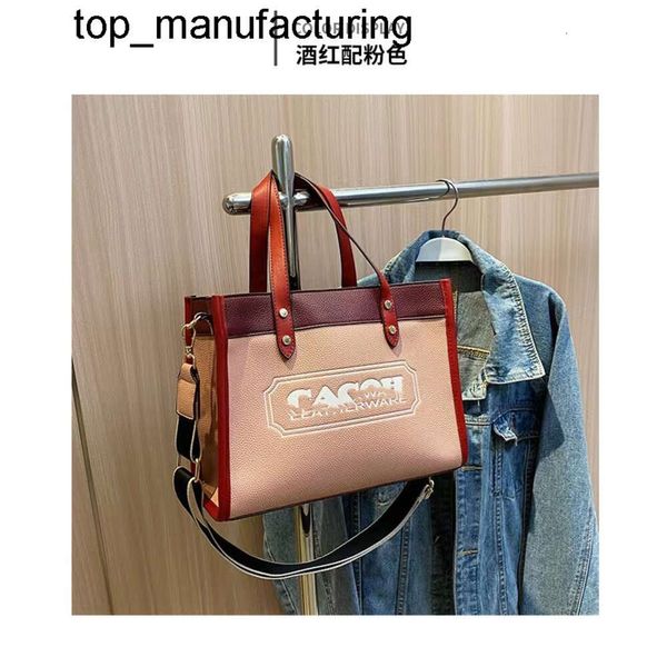 Nuevo 24ss Ventas directas Grano de lichi Carta de gran capacidad Bolsa de asas Marca de moda Bolso Diseñador Textura Solo hombro Crossbody para mujer Bolsa de asas para hombre