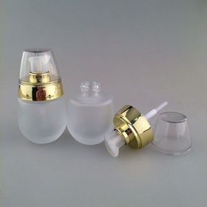 Nuevo 30 ml / 1 oz Frasco cosmético de vidrio esmerilado Dispensador de botellas de viaje para champú de esencia Bomba prensada Envases cosméticos vacíos Uuwxx