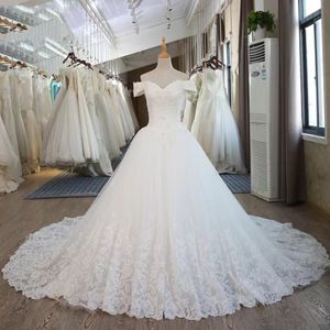 Nouvelles robes de ligne pour la mariée Vestidos de Novia Designer Bridal Robes modestes hors épaule des applications de dentelle de mariage à paillettes Robe OCN 403