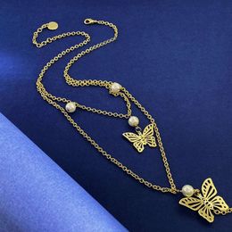 Nouvelle marque d'arrivée Charme de mode long collier Butterfly Pendant rétro Pearl Style Pull Chaîne Femme Femme Bijoux de fête