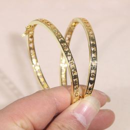 Recién llegado, brazalete de estrella con corazón hueco de diseñador, pulsera de ojo de la suerte de Color dorado, altamente pulida para mujeres y hombres, joyería de moda Hiphop