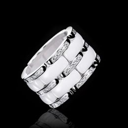 Nueva llegada Fashion Lady 316 Titanio Acero Negro Blanco Cerámica Ajuste Tres filas Diamante Compromiso de boda Anillo chapado en oro de 18 quilates 4124257