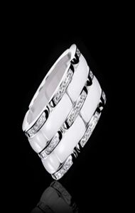 Nieuwe collectie Mode Dame 316 Titanium Staal Zwart Wit Keramische Instelling Drie Rijen Diamanten Bruiloft Verloving 18K Vergulde Ring7538561