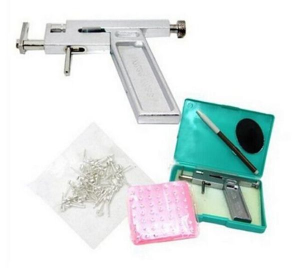 NOUVELLE ARRIVÉE Professionnel Oreille Corps Nez Piercing Pistolet Machine Outil Kit Ensemble + 98 Pcs Acier Goujons Piercing l'Oreille Pistolets Fer Costume Livraison Gratuite